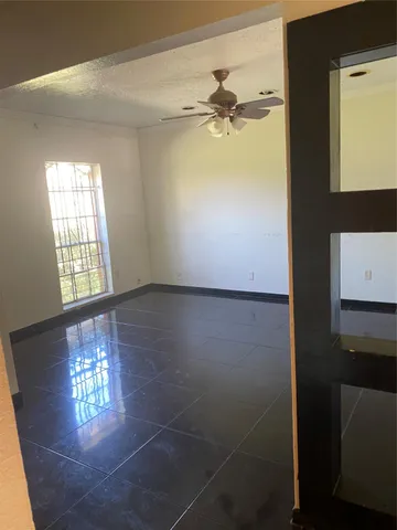 view of an empty room with a window