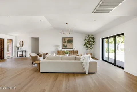 a kitchen with white cabinets and refrigerator