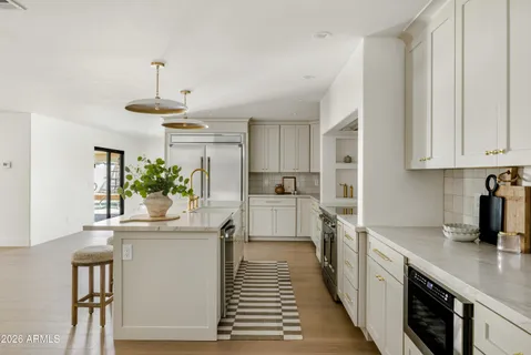 a bedroom with a bed and a lamp