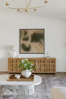 an empty room with a window and wooden floor