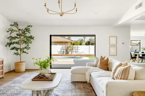 a living room with furniture or window and a wooden floor