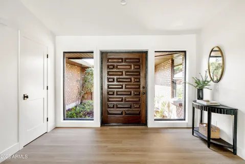 a living room with furniture and a table