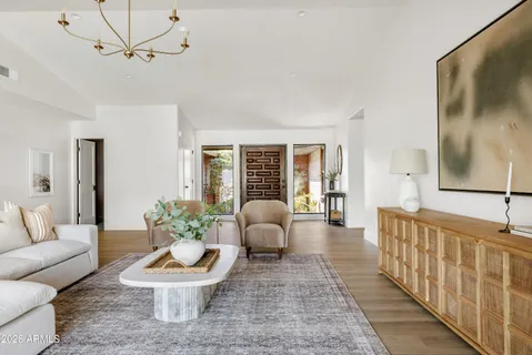 a living room with furniture and a large window