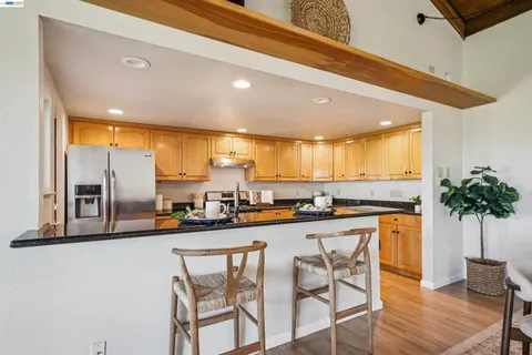 a kitchen with a table and chairs in it