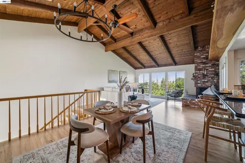 a view of a dining room with furniture window and outside view