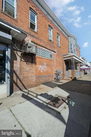 a bathroom with a sink and a blue shower