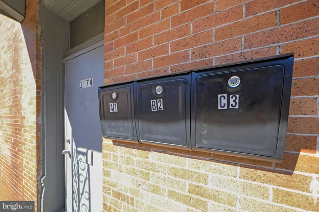 a view of a building with a umbrellas on the street