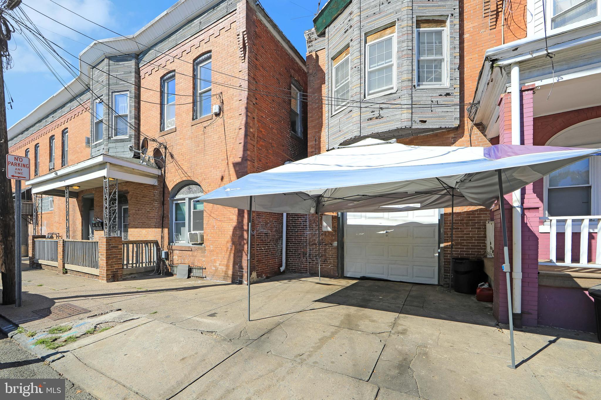 1574 Mt Ephraim Avenue Camden, NJ 08104 - Photo 25 of 54 a view of a building with a umbrellas on the street