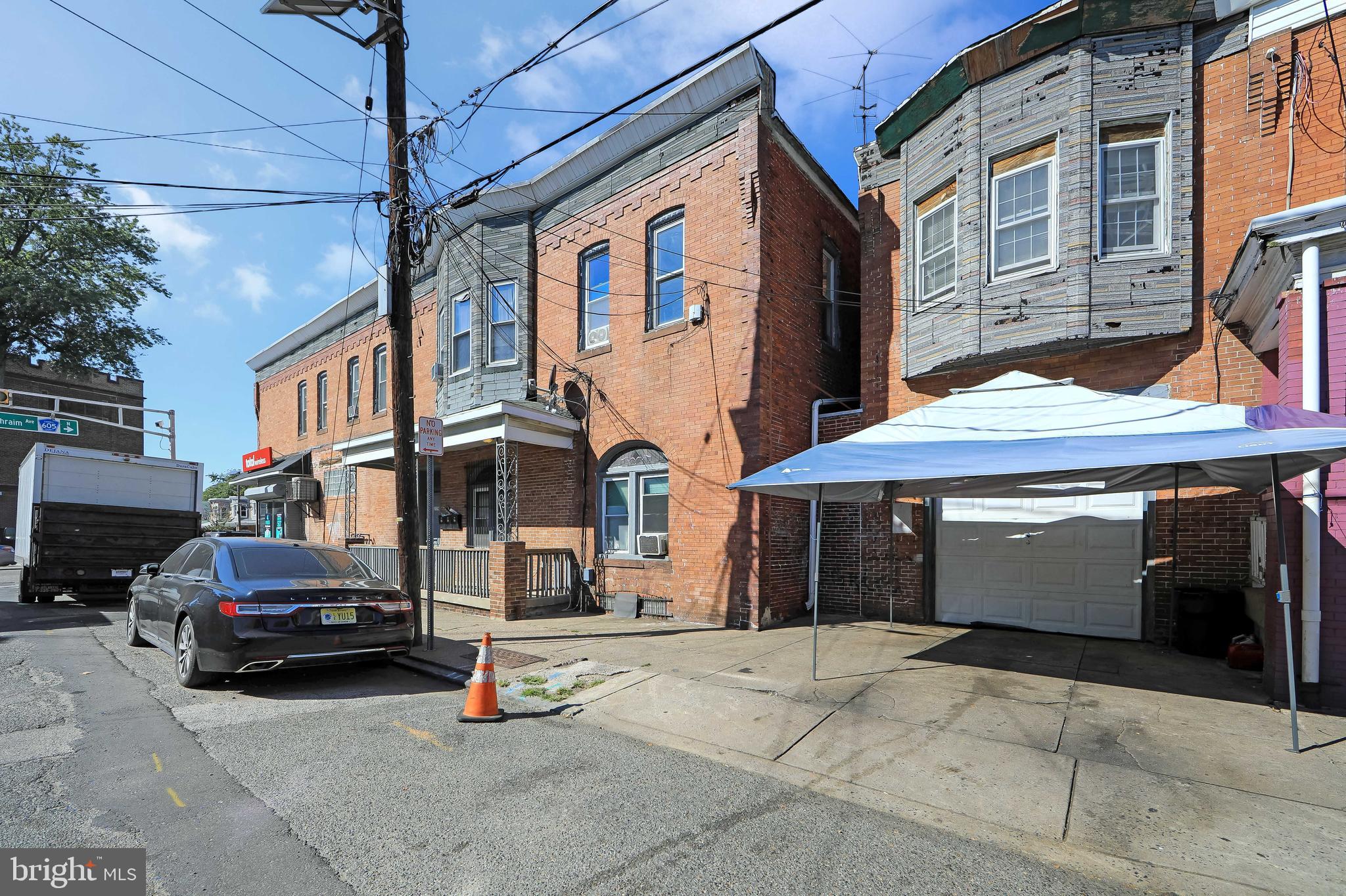 1574 Mt Ephraim Avenue Camden, NJ 08104 - Photo 26 of 54 a car parked in front of a building