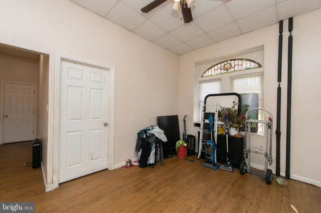 a kitchen with a refrigerator a table and chairs