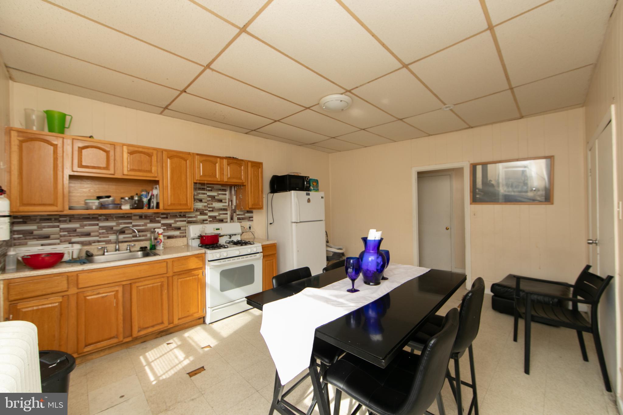 1574 Mt Ephraim Avenue Camden, NJ 08104 - Photo 38 of 54 a kitchen with a cabinets and stove top oven