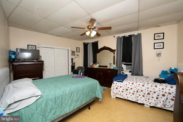 a bathroom with a toilet a sink and a mirror