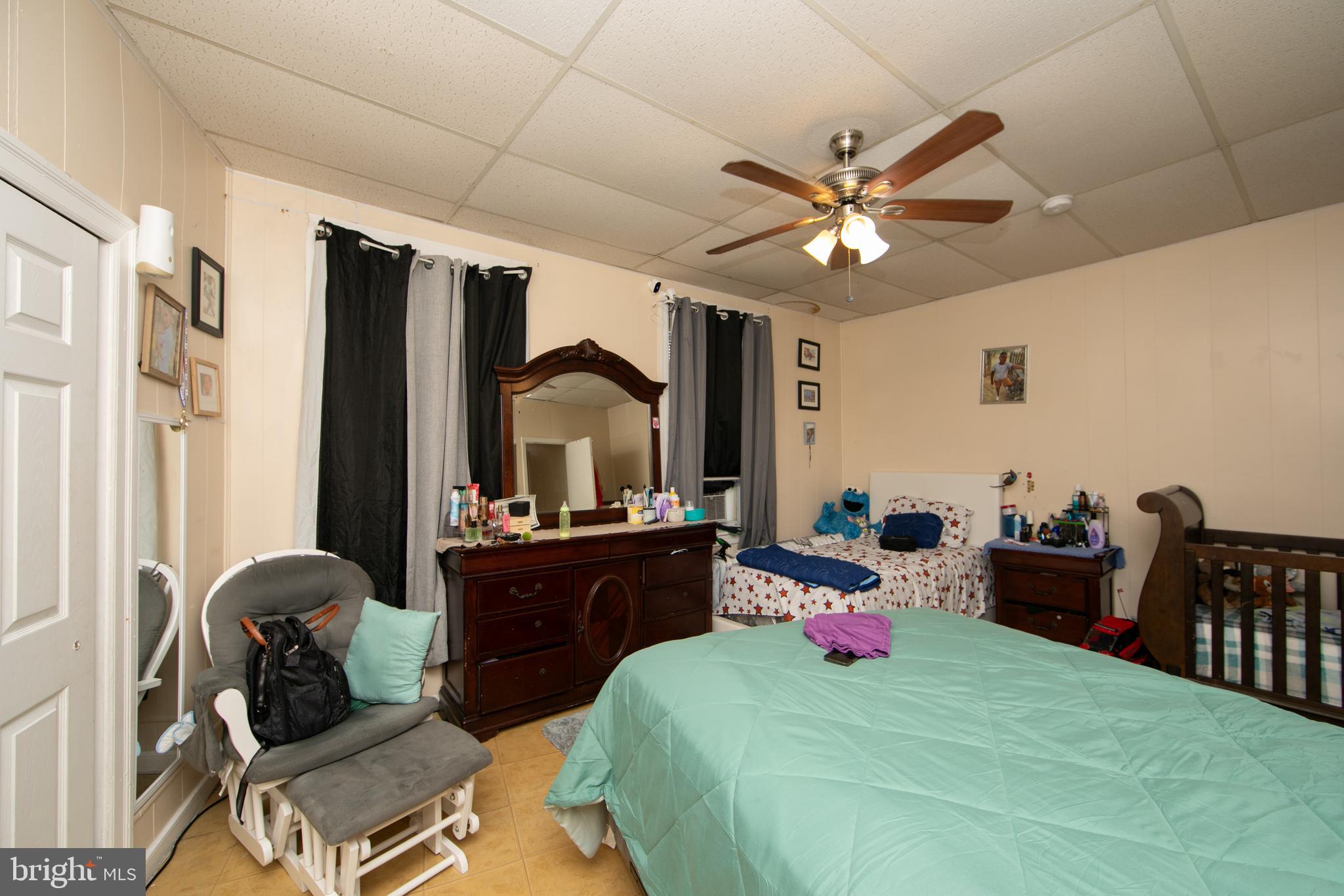 1574 Mt Ephraim Avenue Camden, NJ 08104 - Photo 42 of 54 a bedroom with a bed and furniture