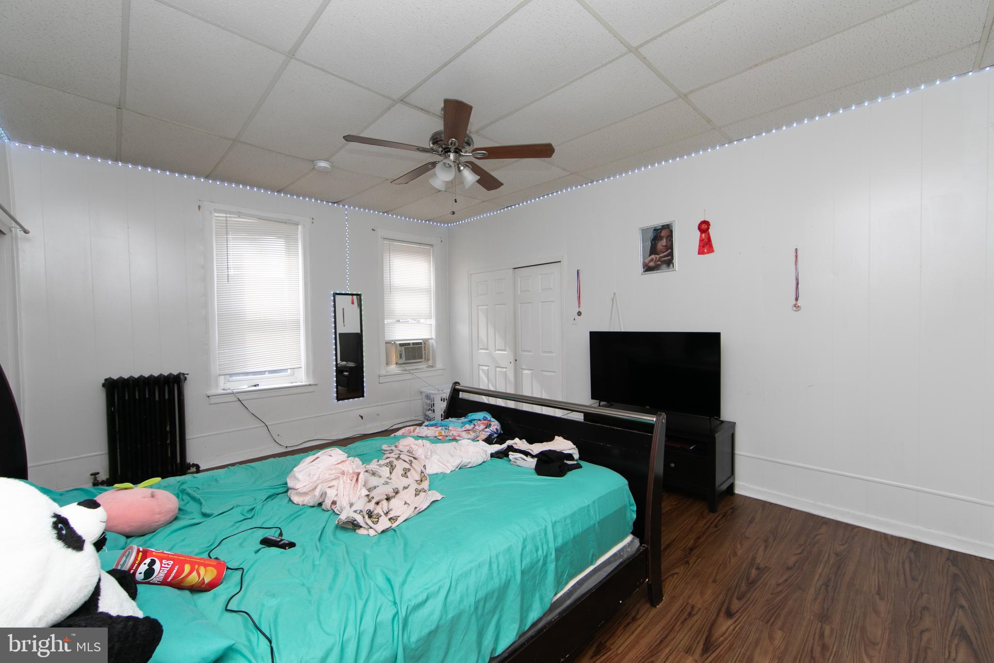 1574 Mt Ephraim Avenue Camden, NJ 08104 - Photo 46 of 54 a bedroom with furniture and a wooden floor