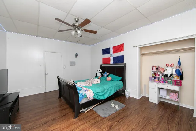 a living room with furniture window and wooden floor