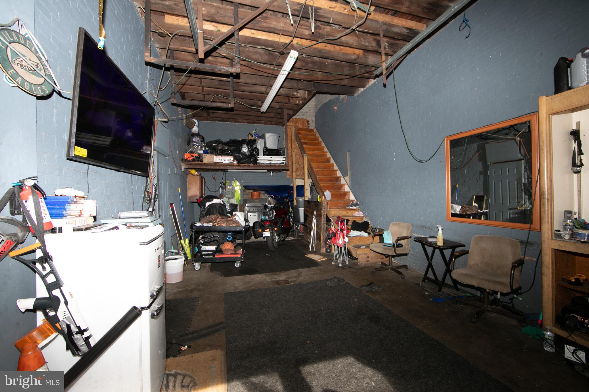 1574 Mt Ephraim Avenue Camden, NJ 08104 - Photo 48 of 54 a view of a storage room with gym equipment