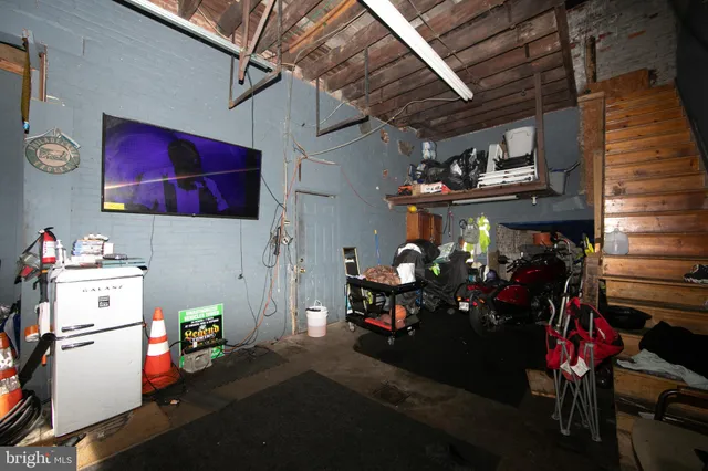 a kitchen with a refrigerator and a stove