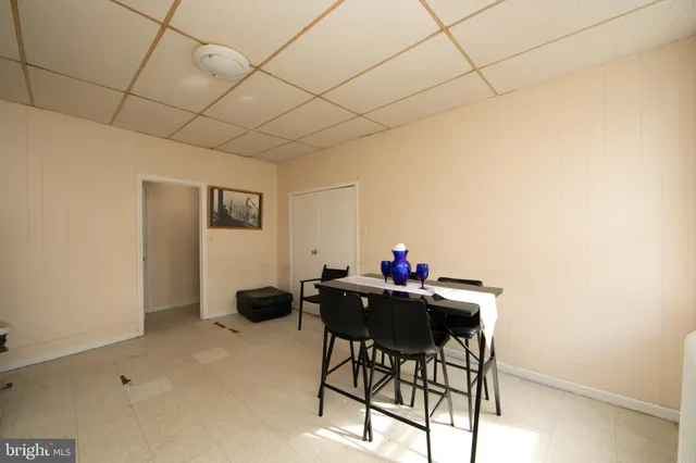 a kitchen with a refrigerator and window