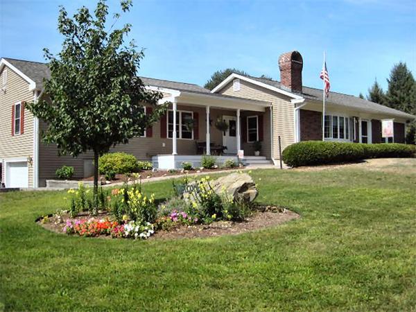 95 Old Ferry Road Haverhill, MA 01830 - Photo 1 of 1 a front view of a house with a yard table and chairs
