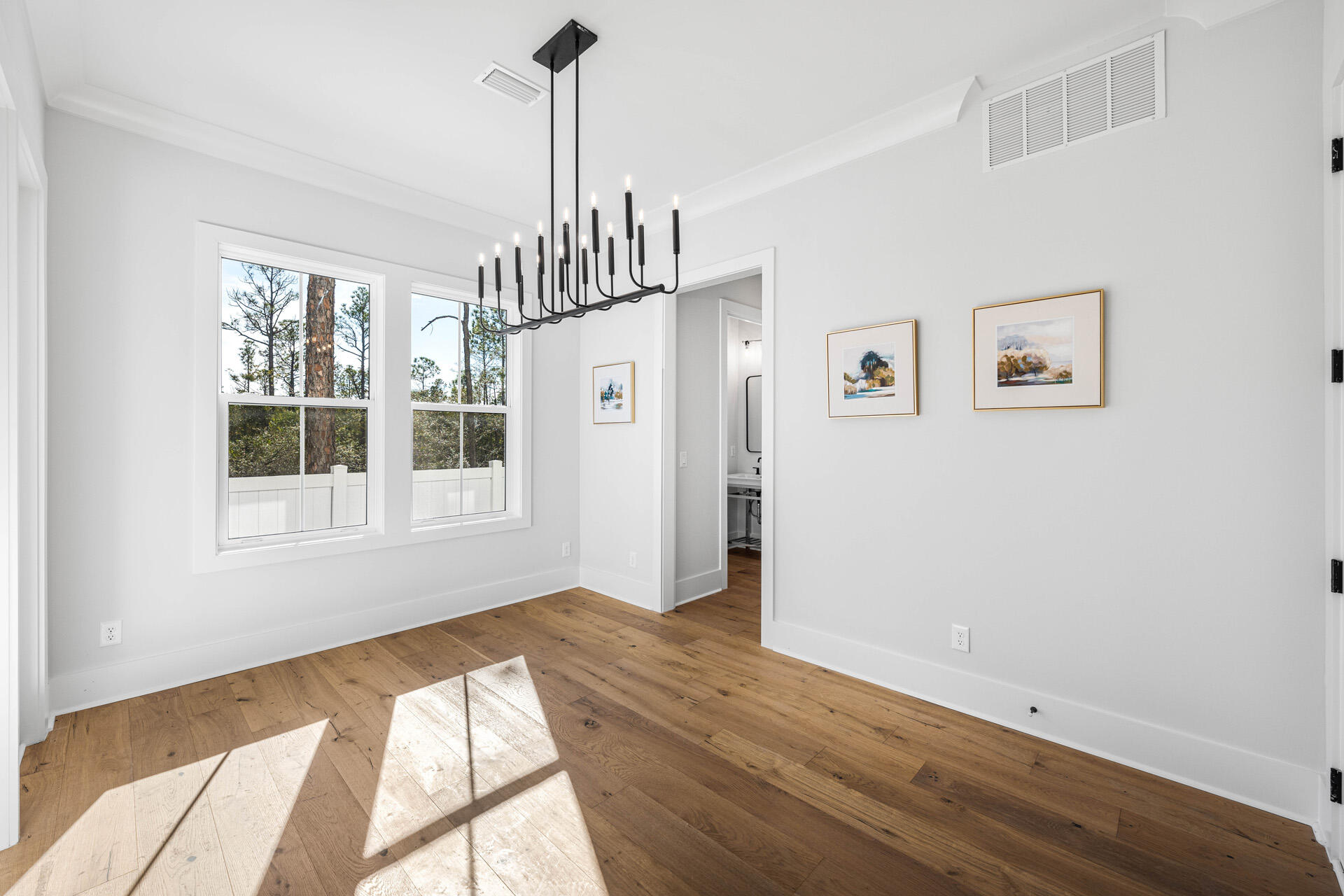 520 South County Highway 393, Unit 39B Santa Rosa Beach, FL 32459 - Photo 11 of 45 a view of empty room with wooden floor and fan