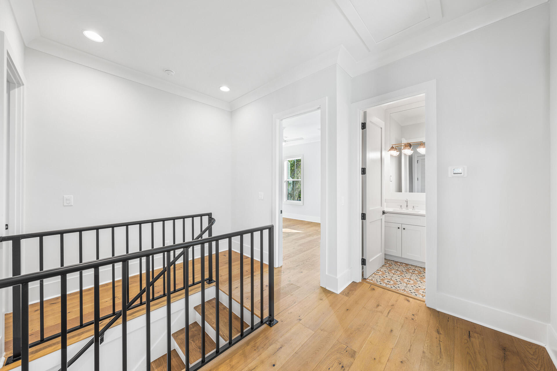 520 South County Highway 393, Unit 39B Santa Rosa Beach, FL 32459 - Photo 15 of 45 a view of a hallway with wooden floor and a bathroom