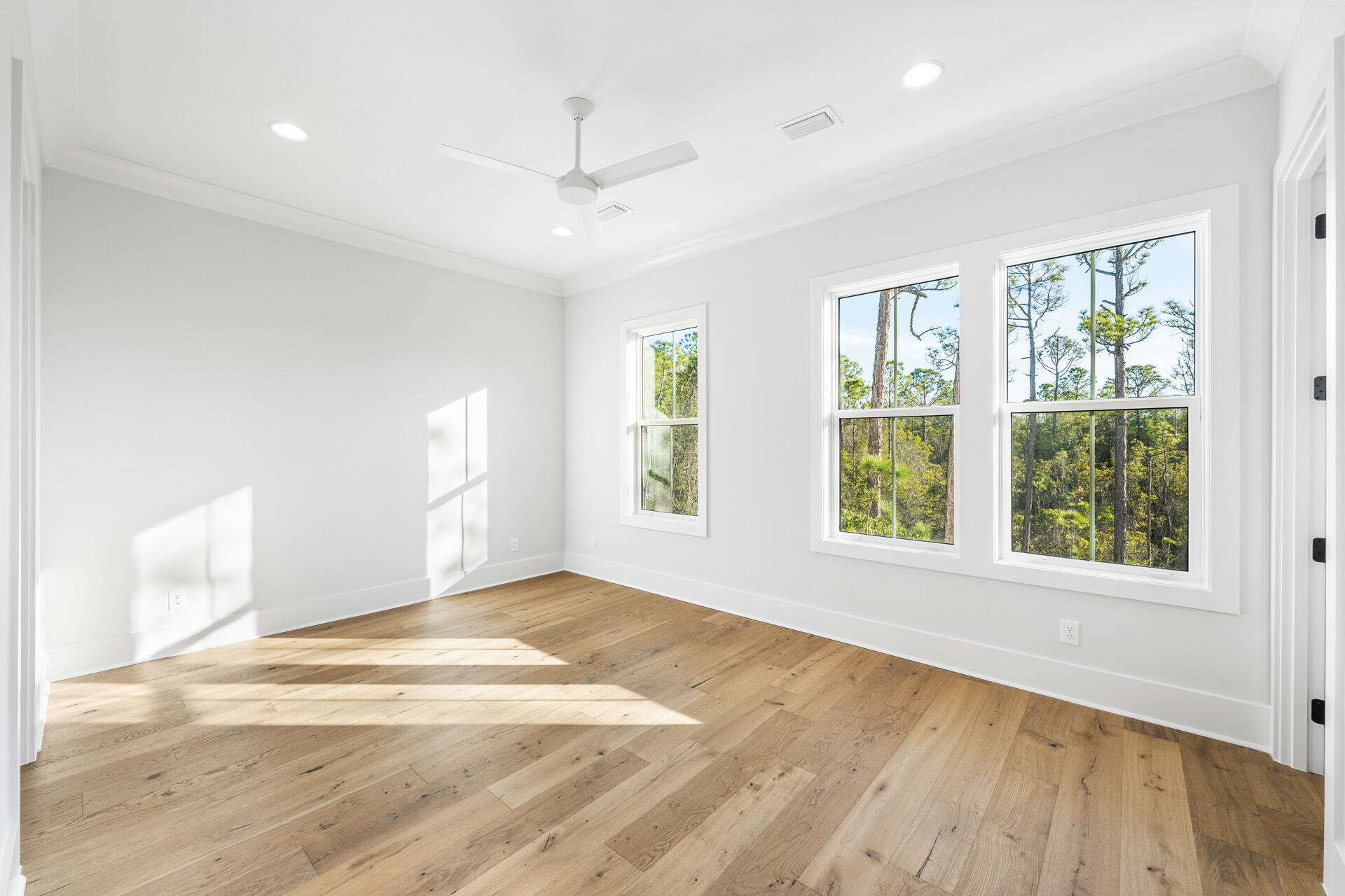 520 South County Highway 393, Unit 39B Santa Rosa Beach, FL 32459 - Photo 16 of 45 a view of an empty room with wooden floor and a window