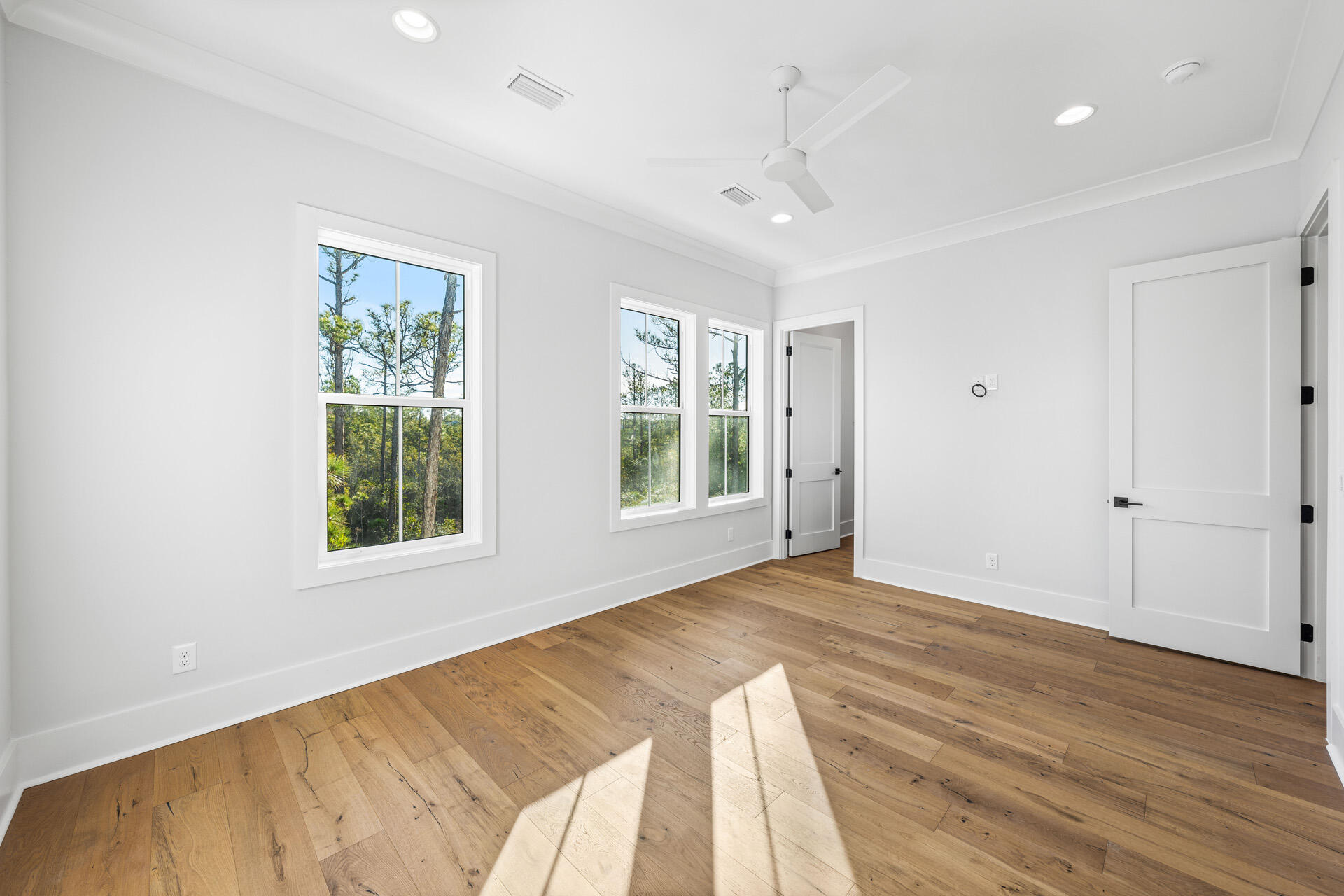 520 South County Highway 393, Unit 39B Santa Rosa Beach, FL 32459 - Photo 18 of 45 a view of an empty room with wooden floor and a window