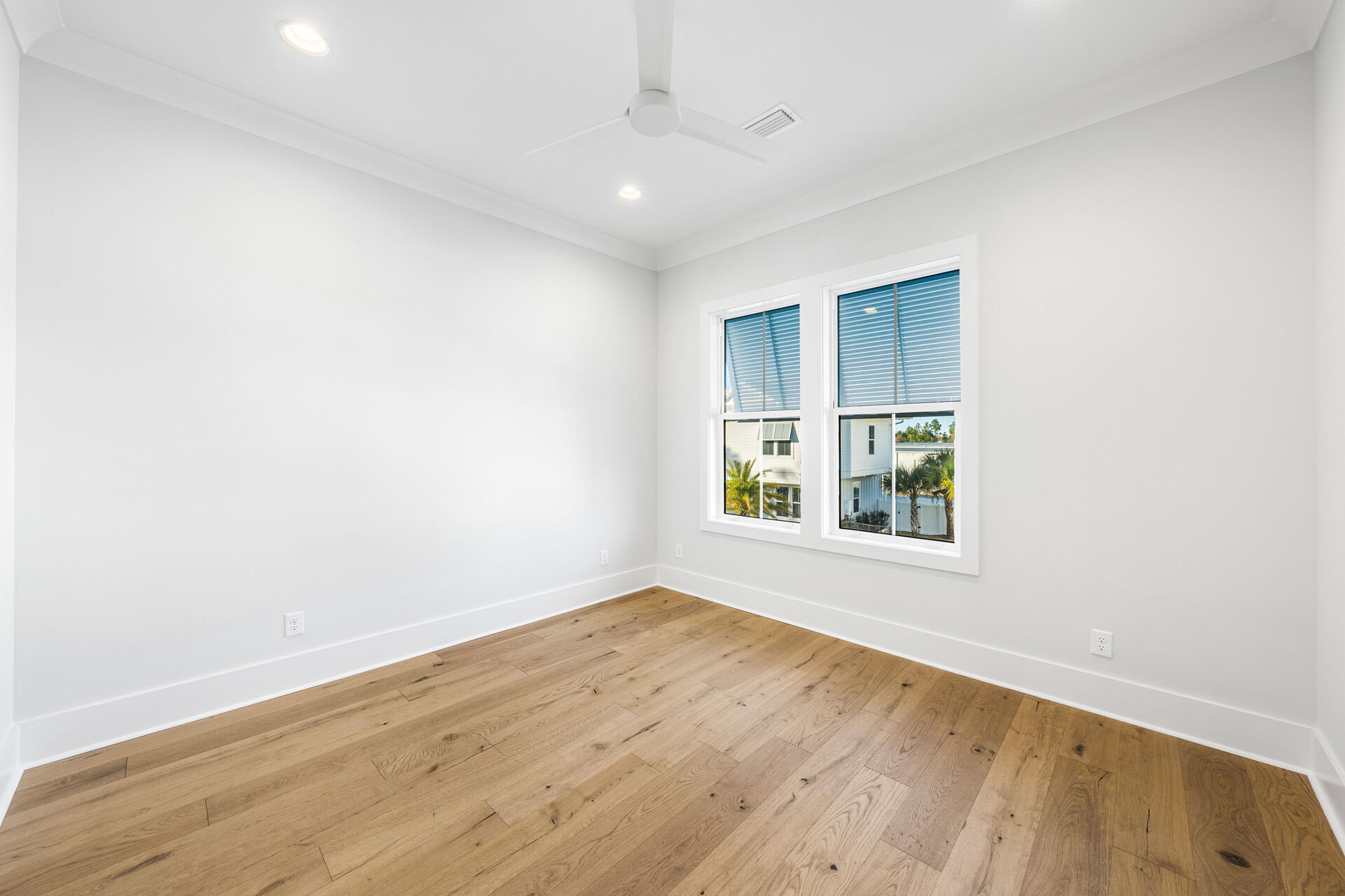 520 South County Highway 393, Unit 39B Santa Rosa Beach, FL 32459 - Photo 22 of 45 an empty room with wooden floor and windows