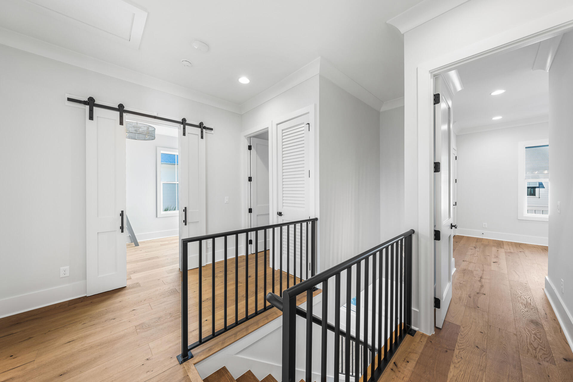 520 South County Highway 393, Unit 39B Santa Rosa Beach, FL 32459 - Photo 30 of 45 a view of a hallway with wooden floor and entryway