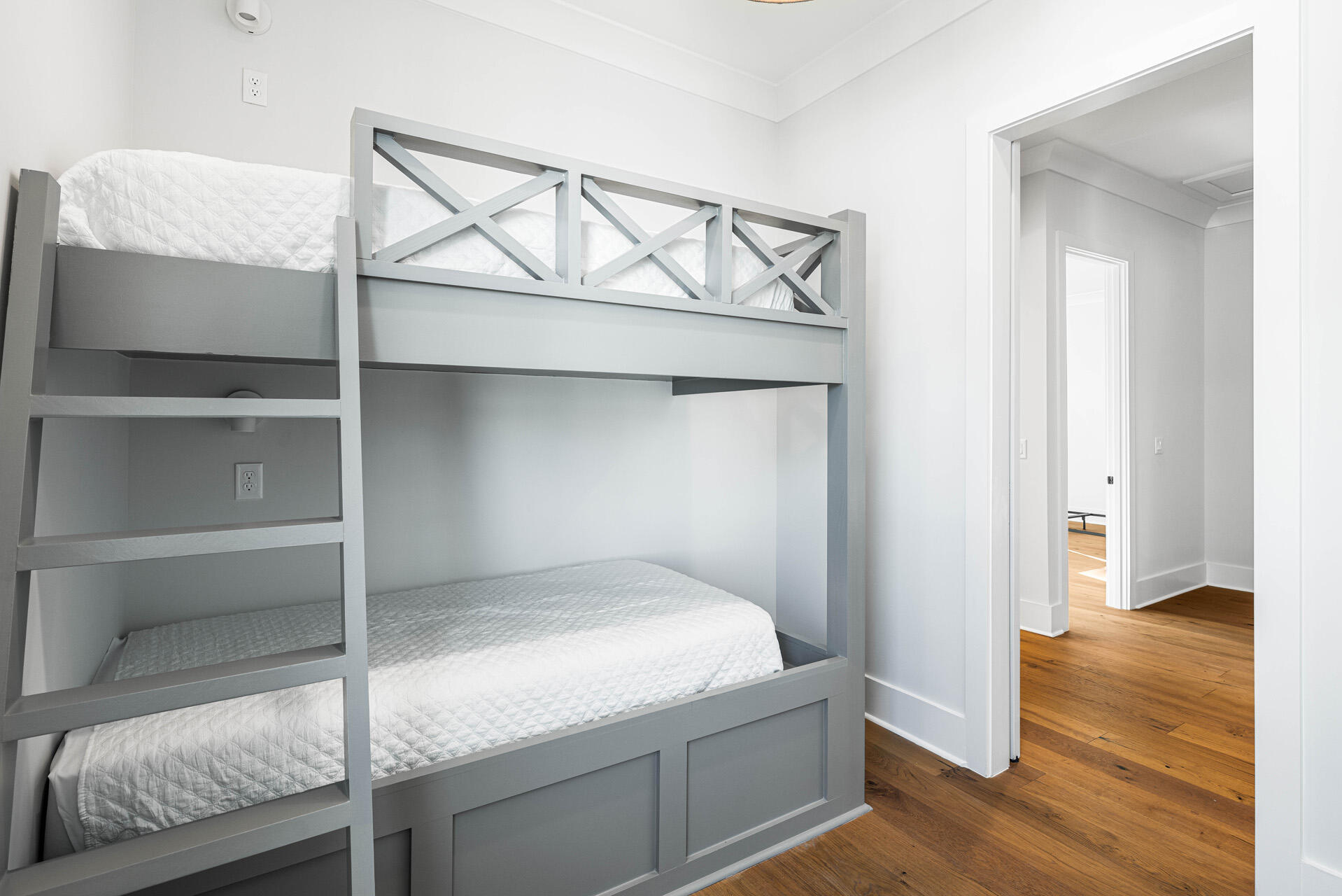 520 South County Highway 393, Unit 39B Santa Rosa Beach, FL 32459 - Photo 32 of 45 a bedroom with a bed and wooden floor