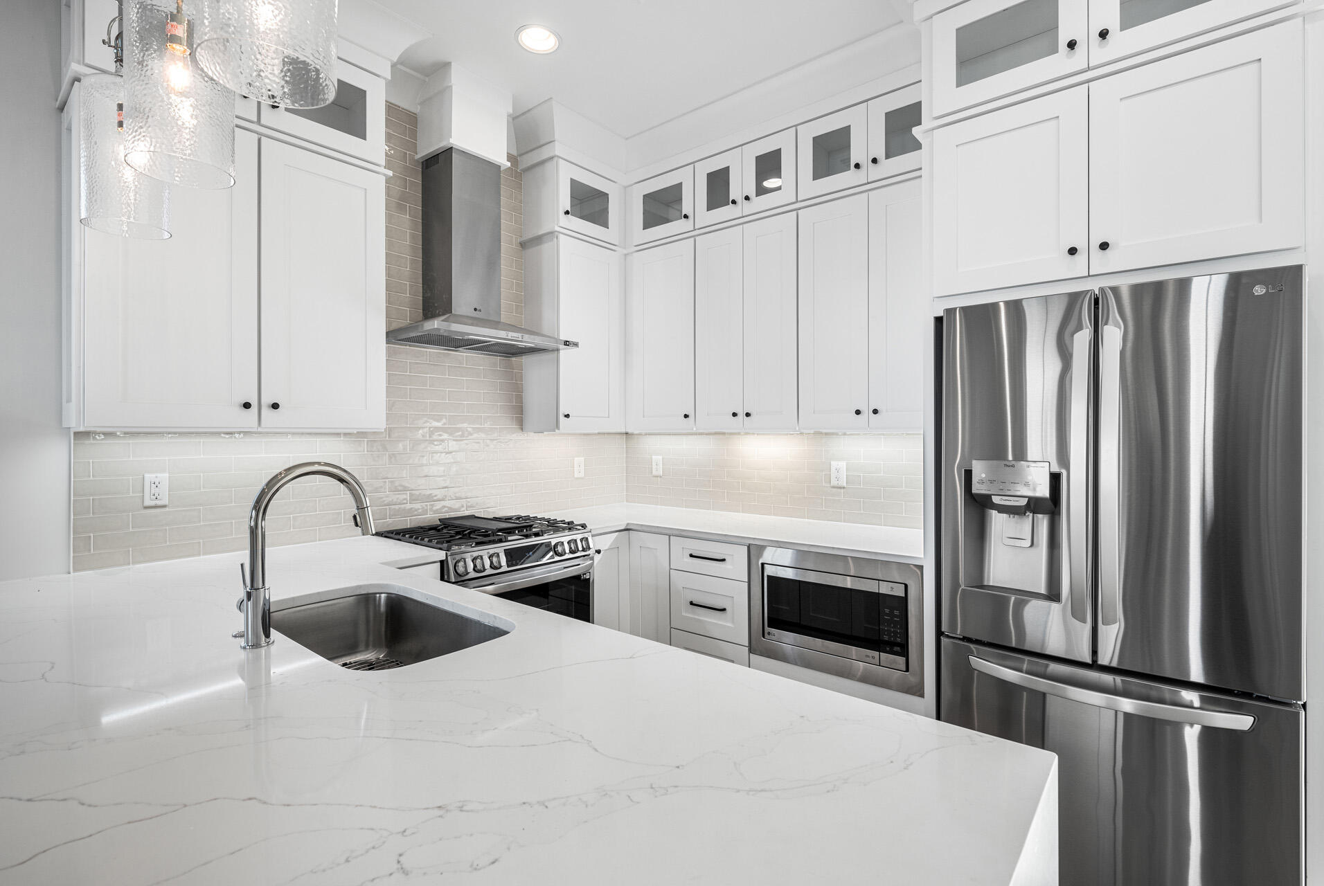 520 South County Highway 393, Unit 39B Santa Rosa Beach, FL 32459 - Photo 6 of 45 a kitchen with stainless steel appliances a refrigerator sink and cabinets