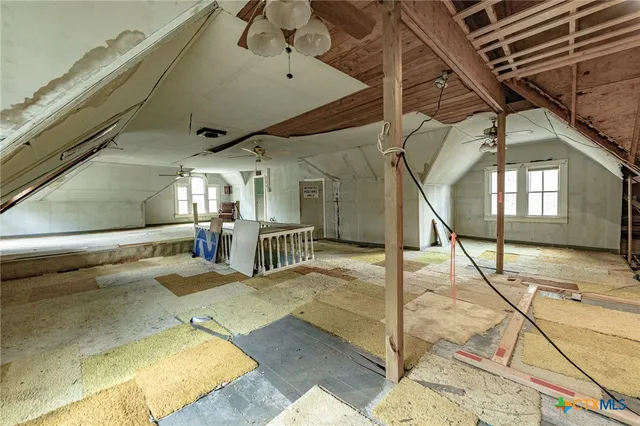 a view of a hallway with a chandelier