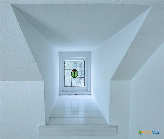 a view of an entryway with wooden floor