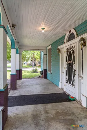 a view of a hallway with washer and dryer