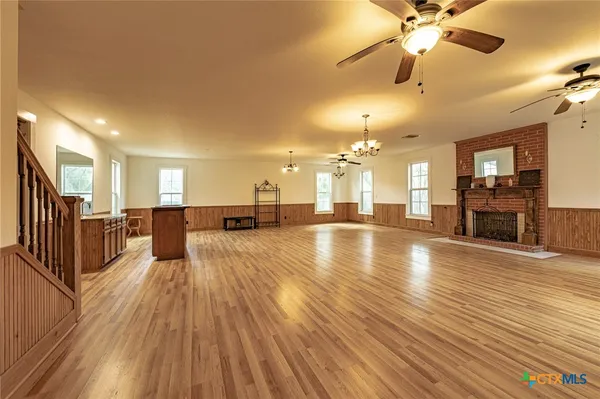 a view of a living room and kitchen with flat screen tv