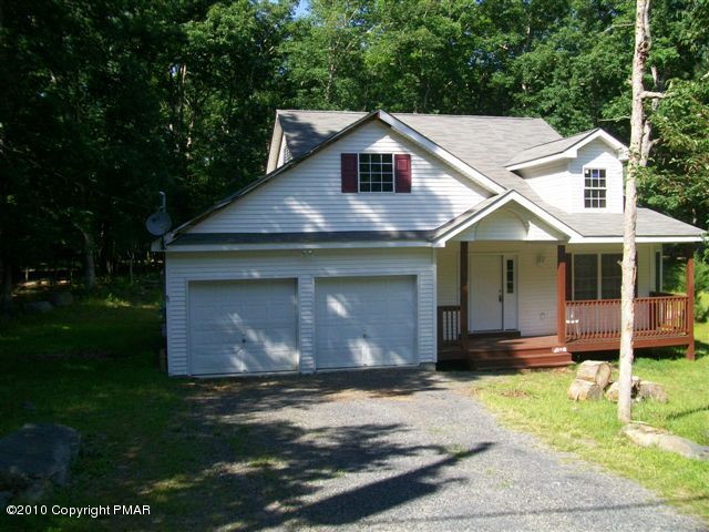 5328 Decker Road Bushkill, PA 18324 - Photo 1 of 1 a front view of a house with garden