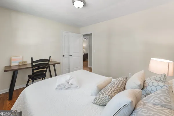 a bedroom with a bed and a table