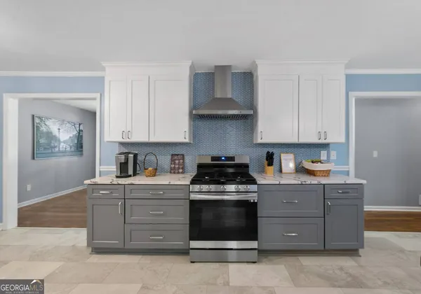 a kitchen with stainless steel appliances granite countertop a stove and a sink