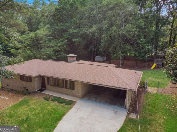 a view of a house with a yard balcony