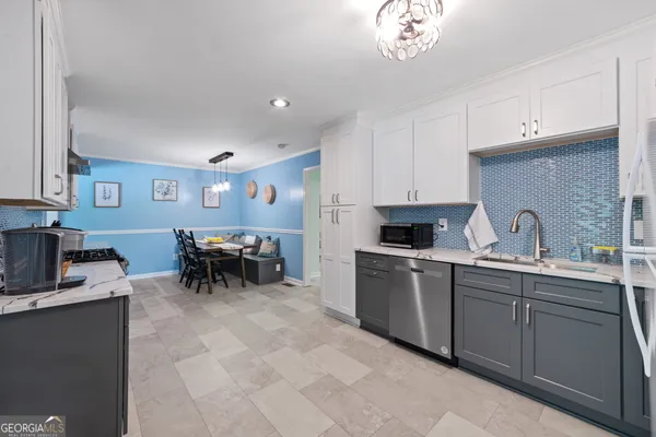 a kitchen with sink cabinets and window