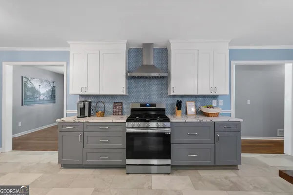 a kitchen with a stove and cabinets