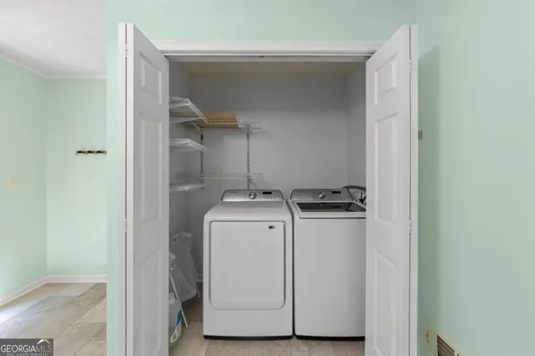 a utility room with dryer and washer