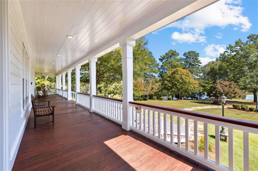 5225 Chalybeate Springs Road Woodland, GA 31836 - Photo 13 of 100 a view of a porch with wooden floor and outdoor space