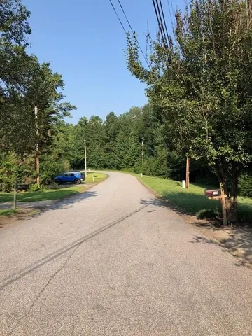 a view of a road with a yard