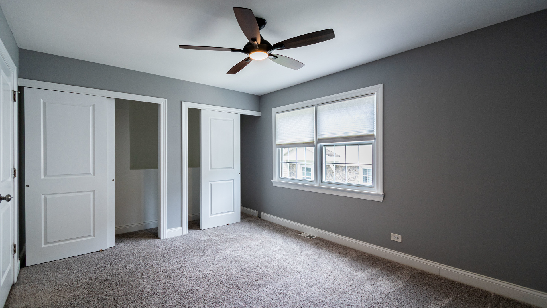 1582 Timber Trail Wheaton, IL 60189 - Photo 19 of 24 a view of a livingroom with a ceiling fan & windows