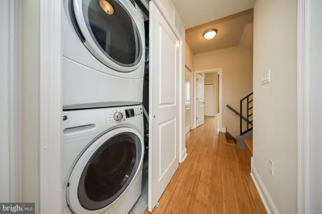 a view of a hallway with washer and dryer