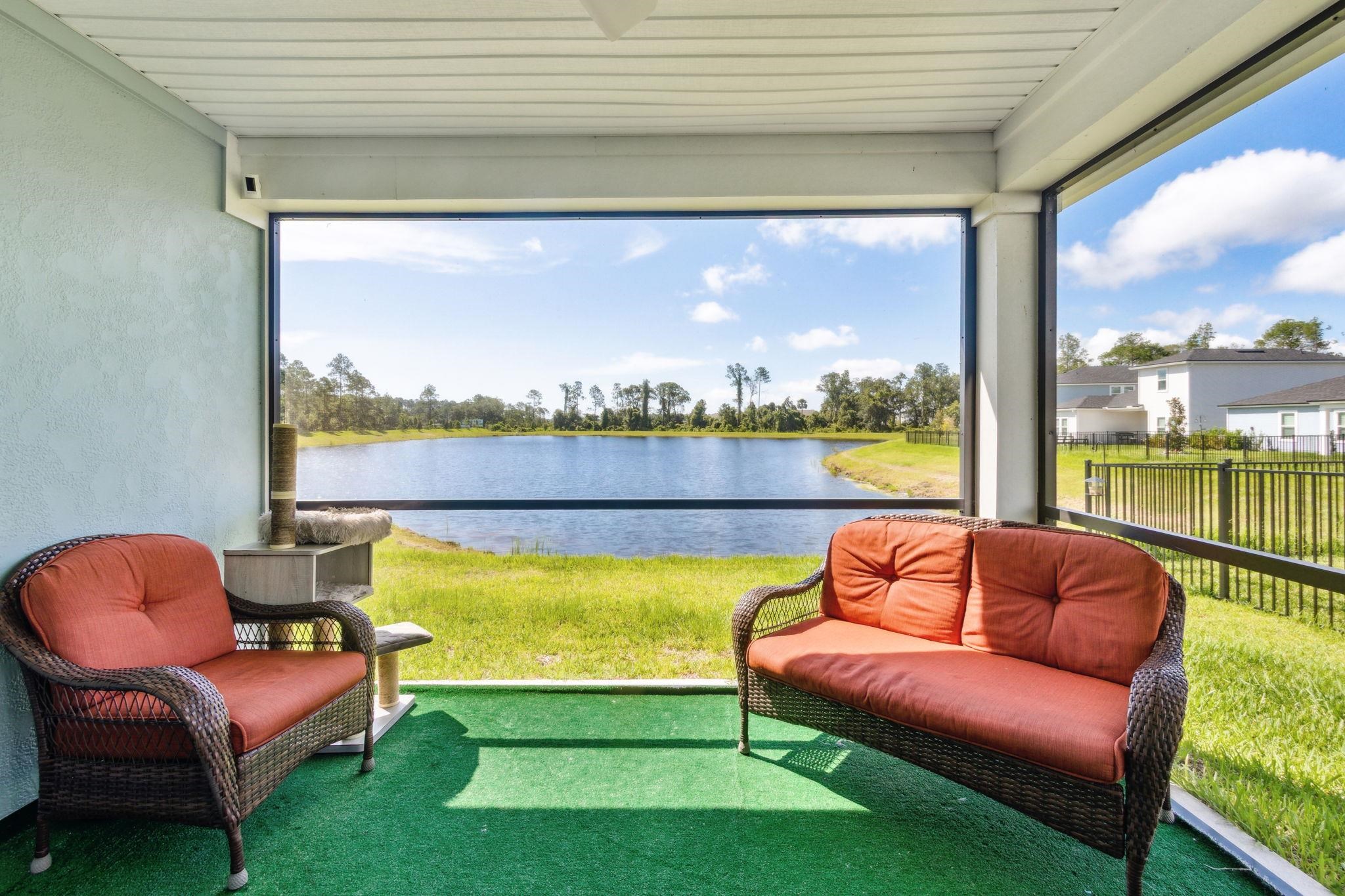 52 Carlota Way St. Augustine, FL 32095 - Photo 11 of 19 a roof deck with couches chairs and city view