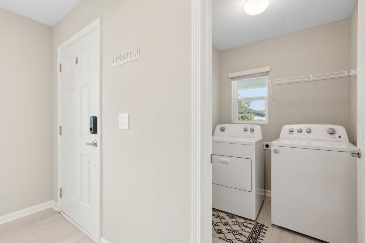 52 Carlota Way St. Augustine, FL 32095 - Photo 16 of 19 a utility room with dryer and washer