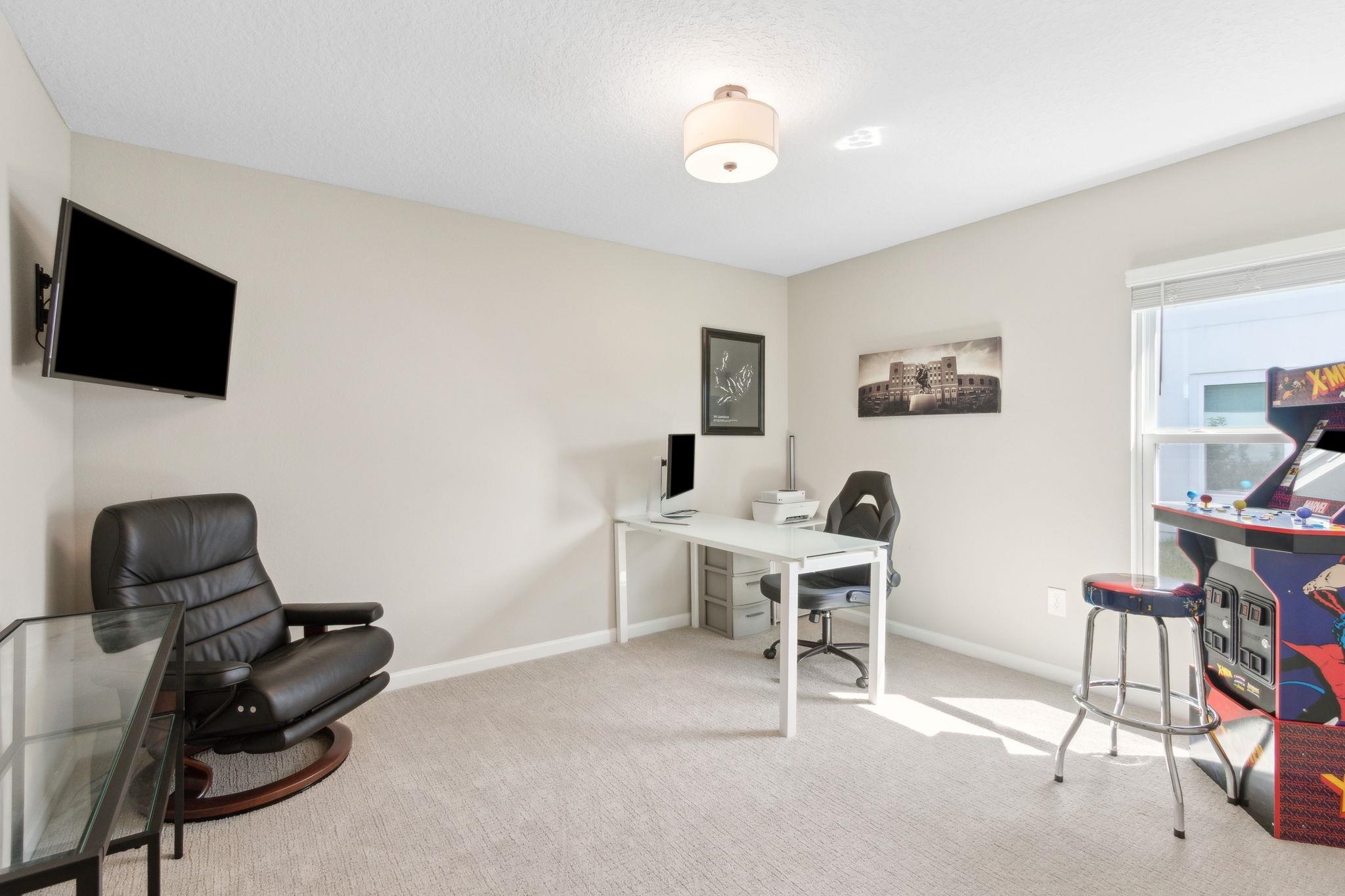 52 Carlota Way St. Augustine, FL 32095 - Photo 10 of 19 a work room with furniture and a flat screen tv