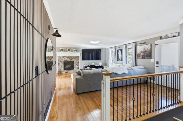 a living room with furniture fireplace and a flat screen tv